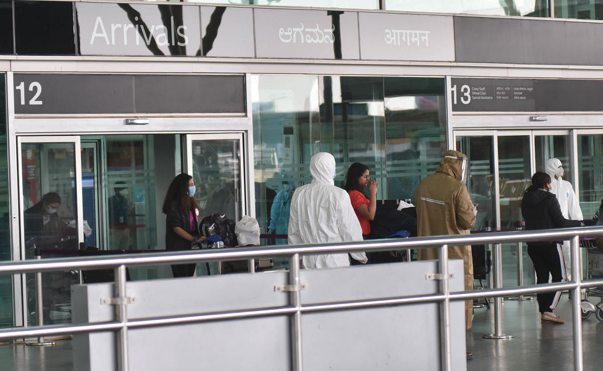 Passengers from the flight, Air India (AI 1803) coming from London, after landed Kempegowda International Airport went to 14 days quarantine at a bus, in Bengaluru on Monday early morning 11 May, 2020. Photo by Janardhan B K | DH Photo