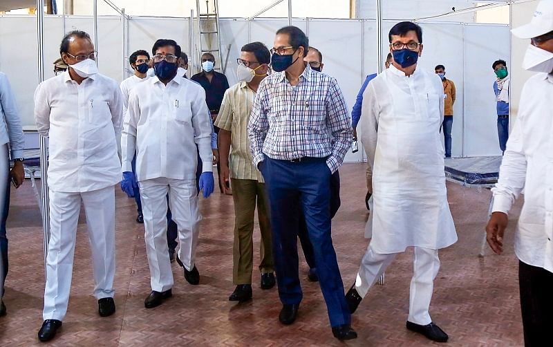 Maharashtra Chief Minister Uddhav Thackeray and Deputy CM Ajit Pawar along with others take a round of the newly prepared special COVIL-19 hospital. (PTI Photo)