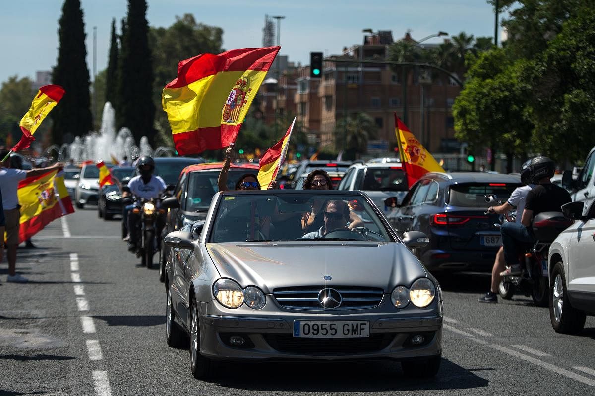 Demonstrators take part in a "caravan for Spain and its freedom" protest by far-right party Vox in Sevilla on May 23, 2020. Credit: AFP Photo