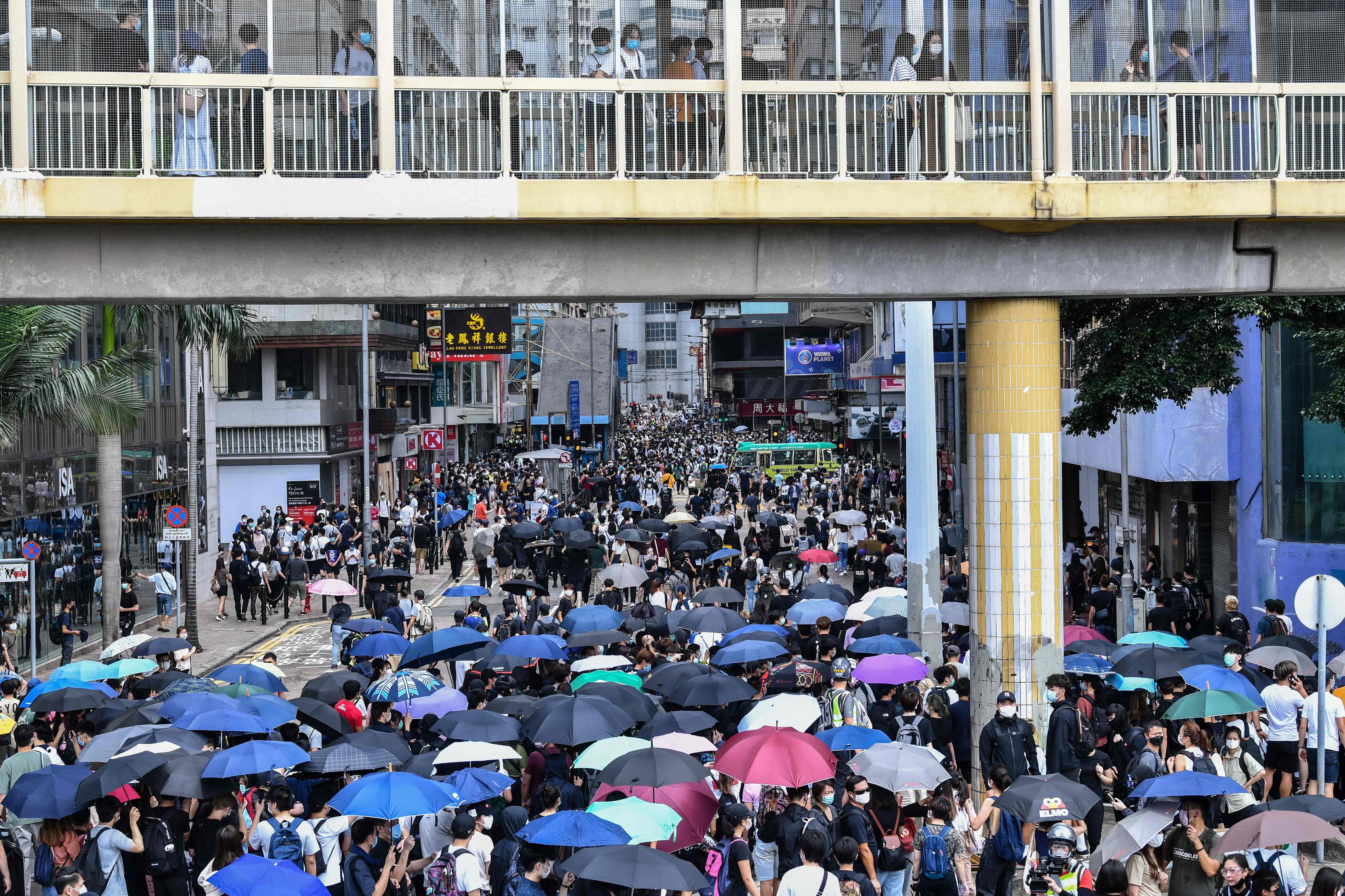 Protesters march on a road during a pro-democracy rally against a proposed new security law in Hong Kong. (AFP photo)