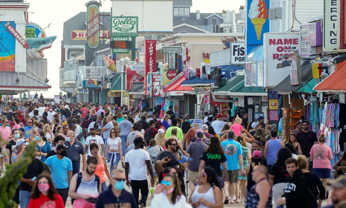 With the relaxing of the coronavirus disease (COVID-19) restrictions, visitors crowd the boardwalk on Memorial Day weekend in Ocean City, Maryland, U.S., May 23, 2020. Credit: Reuters Photo