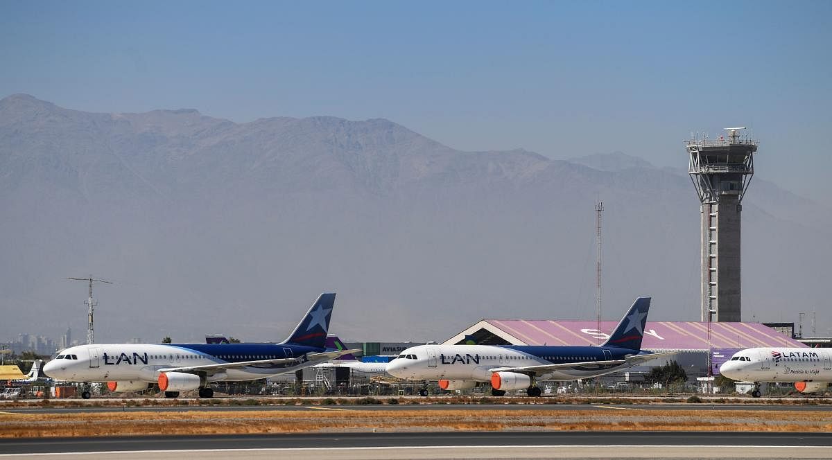 In this file photo taken on March 24, 2020 aircrafts of Latam airline sit on the tarmac at Santiago International Airport, in Santiago. AFP