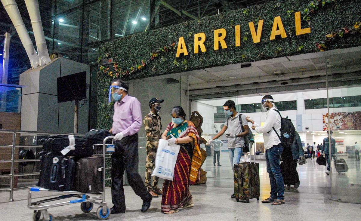 Passengers arriving from New Delhi check-out from the airport in Bhubaneswar, Tuesday, May 26, 2020, a day after the resumption of domestic flight operations. (PTI Photo) 