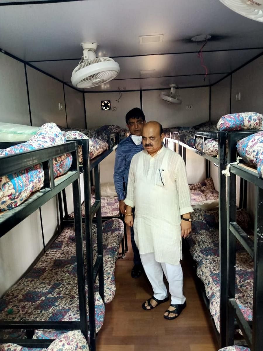Home Minister Basavaraj Bommai inspects a model of the mobile resting unit to be set up at six checkposts in Karnataka. Special arrangement