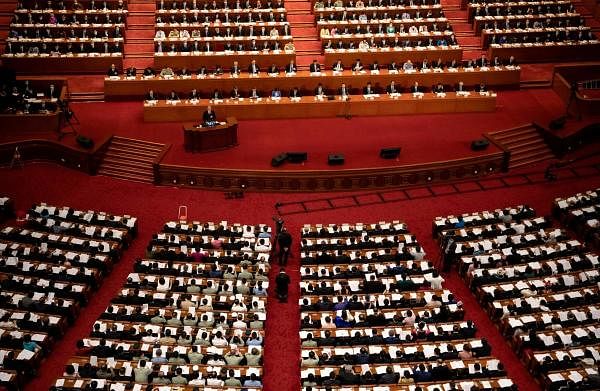 China's President Xi Jinping (top C) attends the second plenary session of the National People’s Congress (NPC) at the Great Hall of the People in Beijing on May 25, 2020. (Credit: AFP Photo)