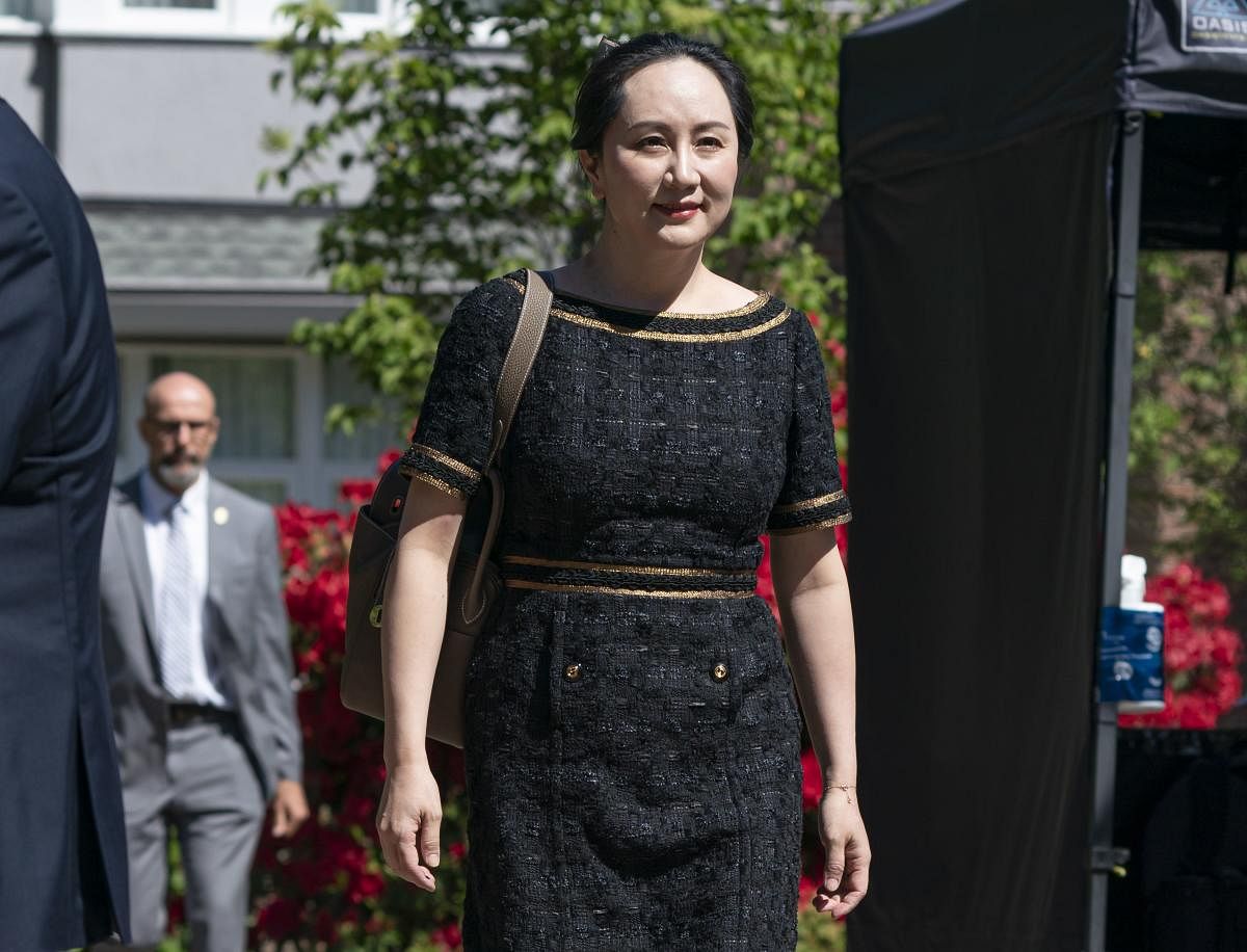 Meng Wanzhou, CFO of Huawei, walks down her driveway to her car as she departs her home for BC Supreme Court on May 27, 2020 in Vancouver, Canada. 