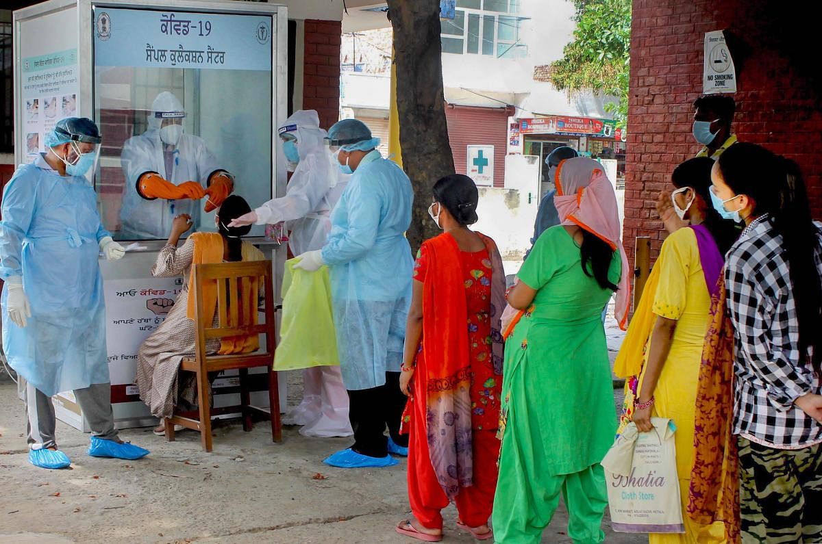  Medics take samples from pregnant women for COVID-19 swab tests, during the ongoing nationwide lockdown to curb the spread of coronavirus , in Patiala, Sunday, May 17, 2020. (PTI Photo)