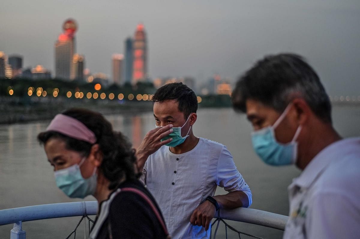 People wearing facemasks are seen on a tourist ship that sail in Yangtze River in Wuhan, in China’s central Hubei province on May 23, 2020. Credit: AFP Photo