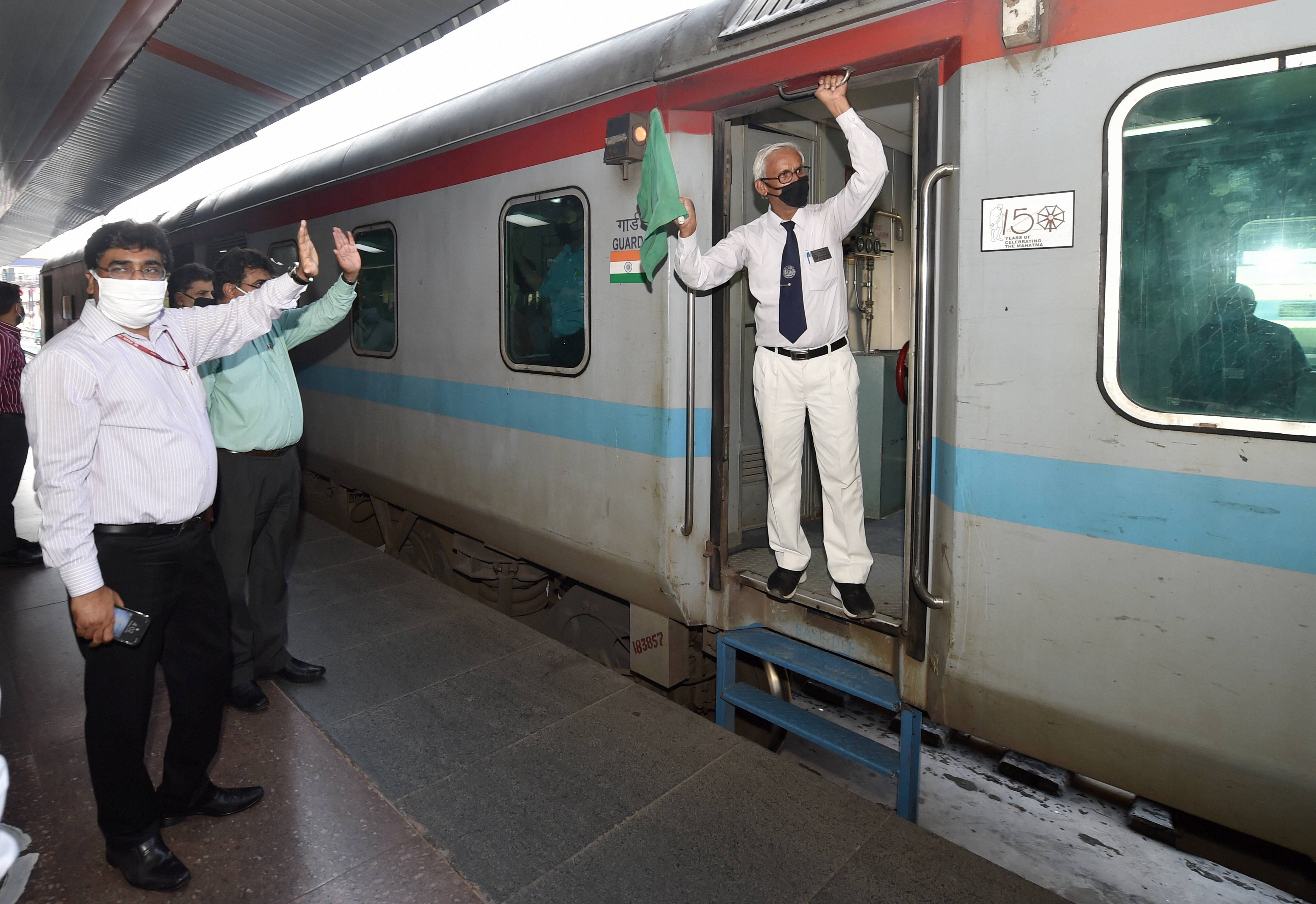 Railway Board Chairman V K Yadav waves as New Delhi-Bilaspur special train leaves the New Delhi Railway Station amid COVID-19 lockdown (Credit: PTI Photo)