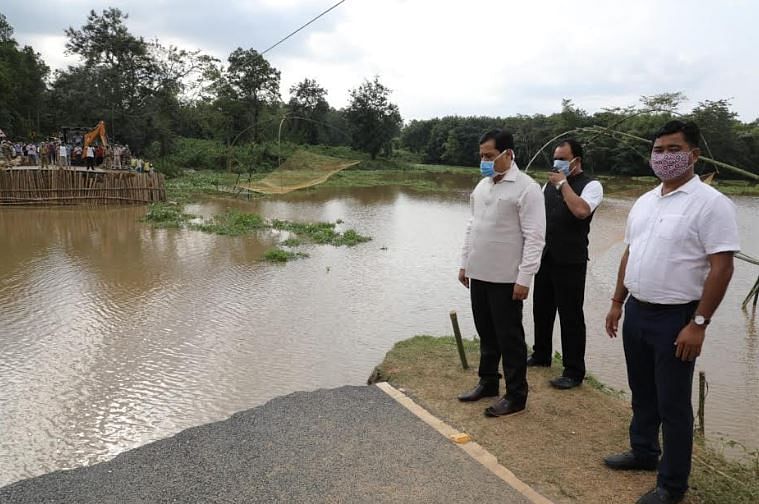  Assam CM Sarbananda Sonowal inspecting a state highway eroded by flooded in Goalpara district on Friday. (Photo credit: Assam govt.) 