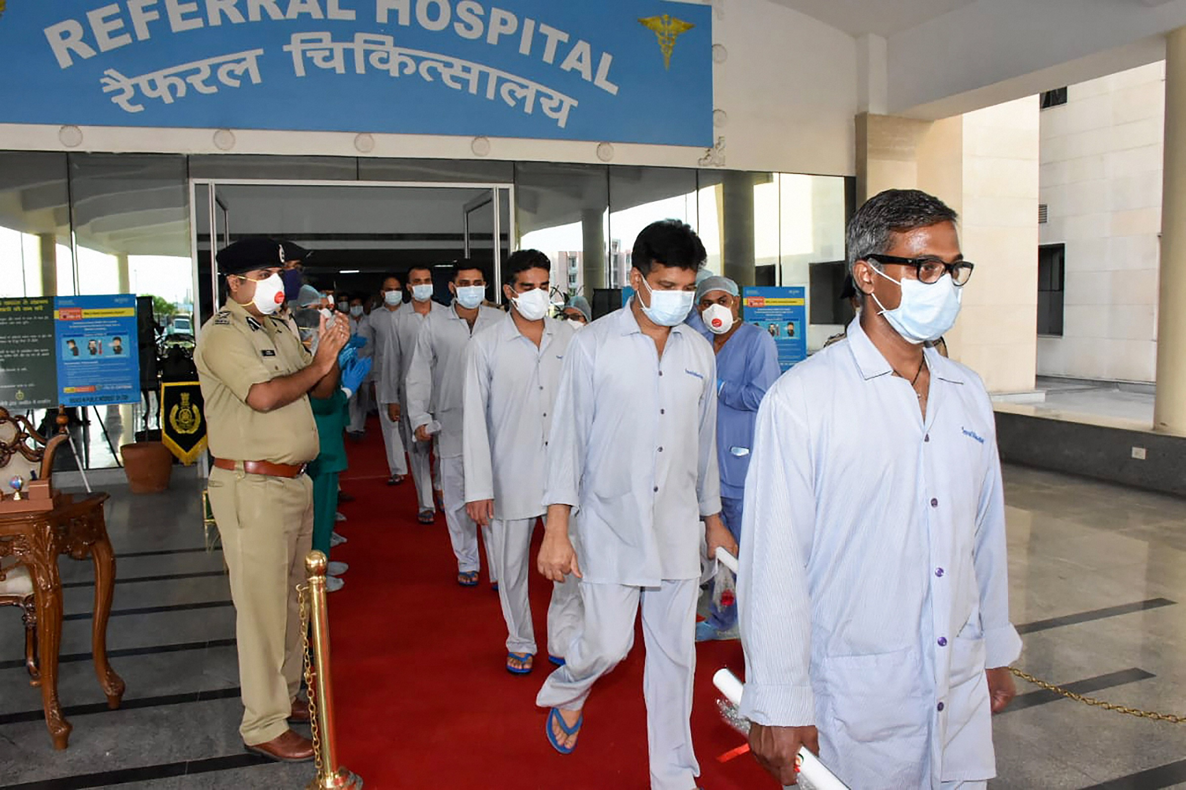 Central Armed Police Forces (CAPF) jawans, who recovered from Covid19 infection, being discharged from CAPF Referral Hospital in Greater Noida, (Credit: PTI photo)