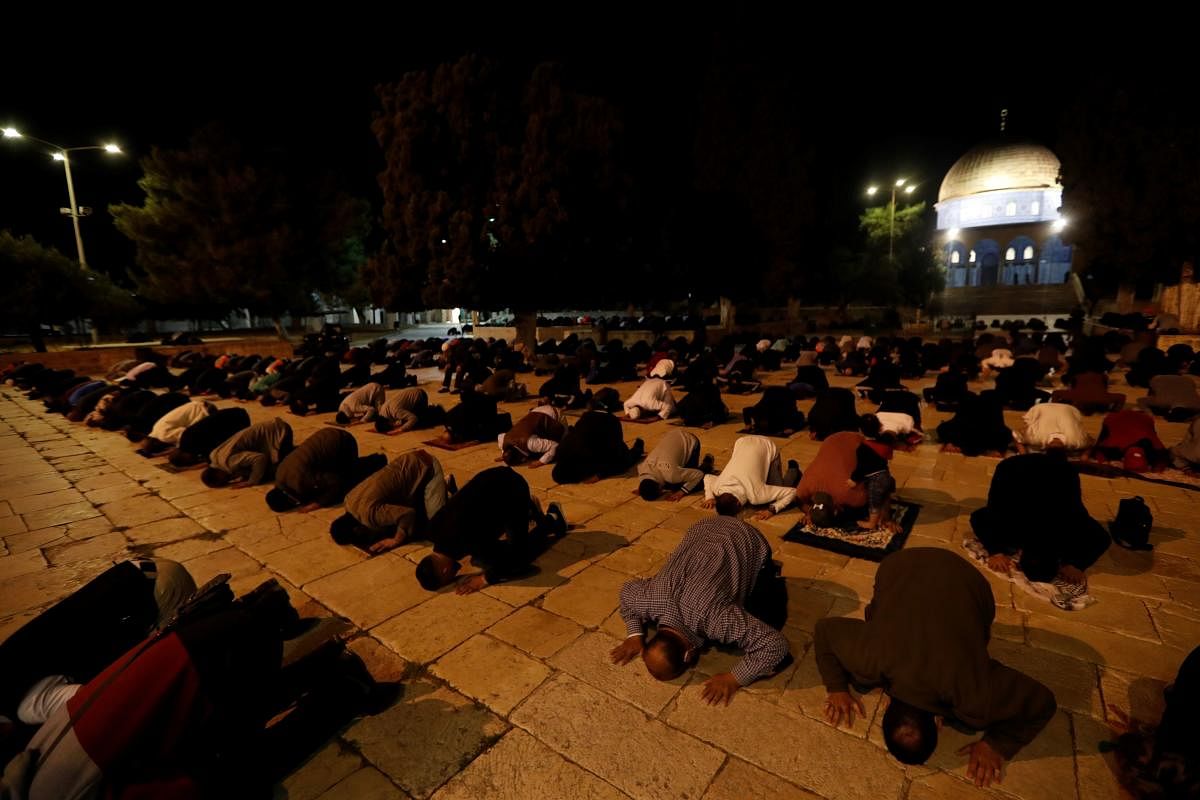 Plastenian Muslim worshippers pray at the al-Aqsa mosque compound, Islam's third holiest site, in Jerusalem's Old City on June 1, 2020, after a two-month closure due to the COVID-19 pandemic. AFP