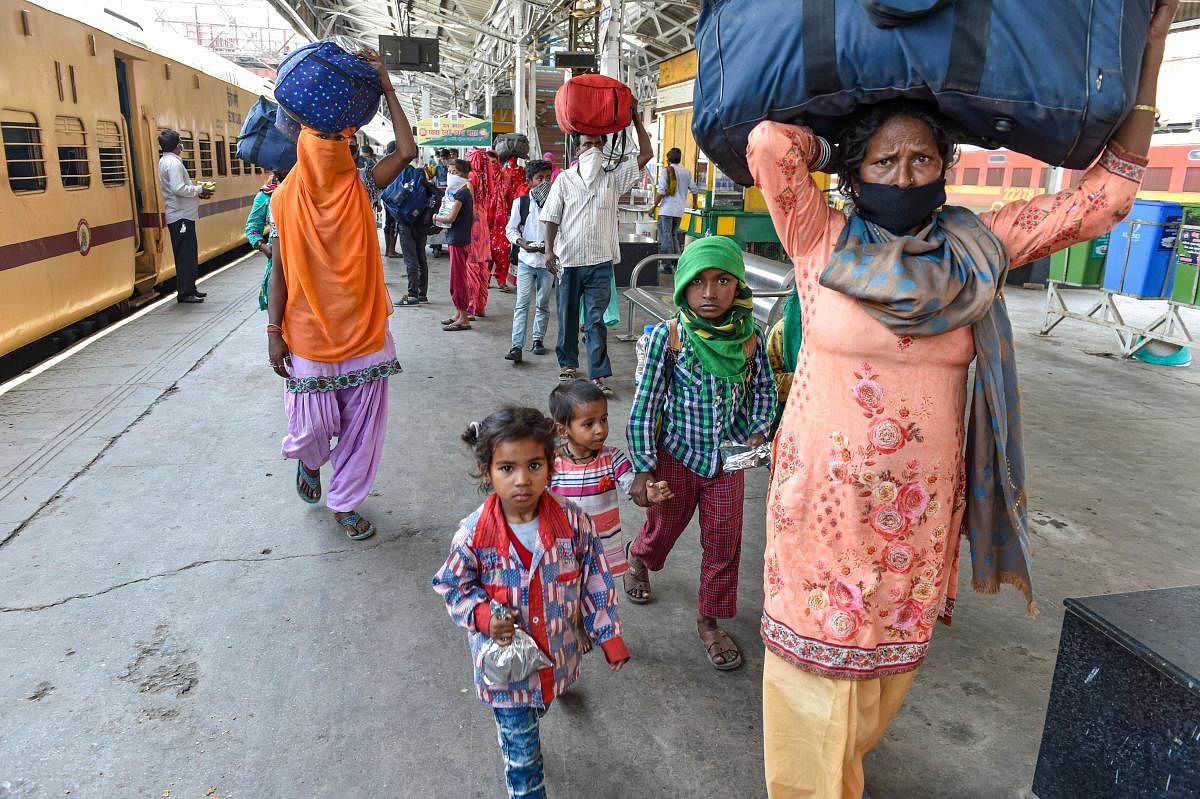 Lucknow: Migrants with their belongings deboard a train after arriving at Charbagh railway station, during the ongoing COVID-19 lockdown, in Lucknow, Sunday, May 31, 2020. (PTI Photo/Nand Kumar)(PTI31-05-2020_000147B)