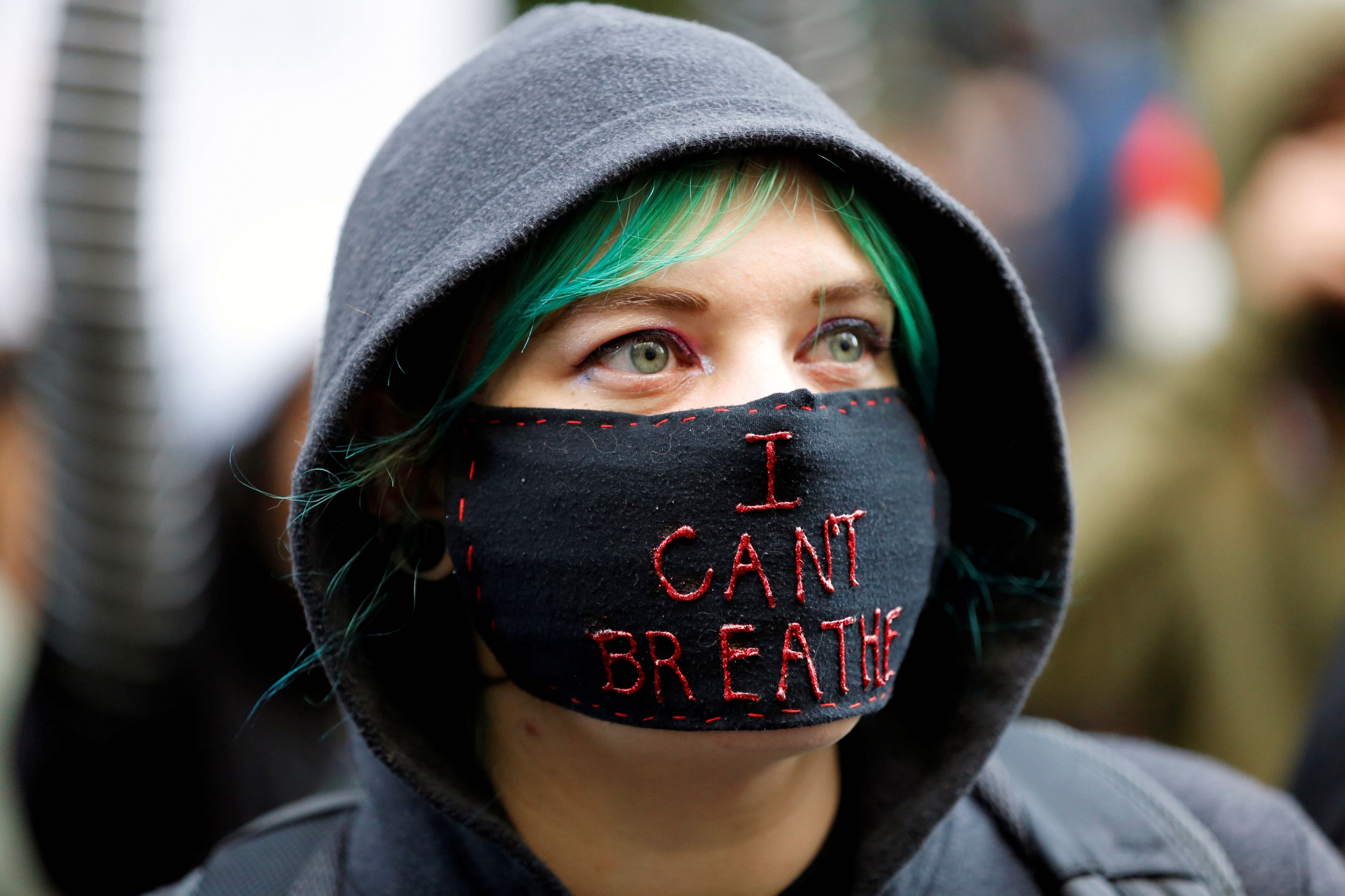 A protester wearing a face mask attends a rally against the death in Minneapolis police custody of George Floyd, in Portland, Oregon. (Reuters photo)
