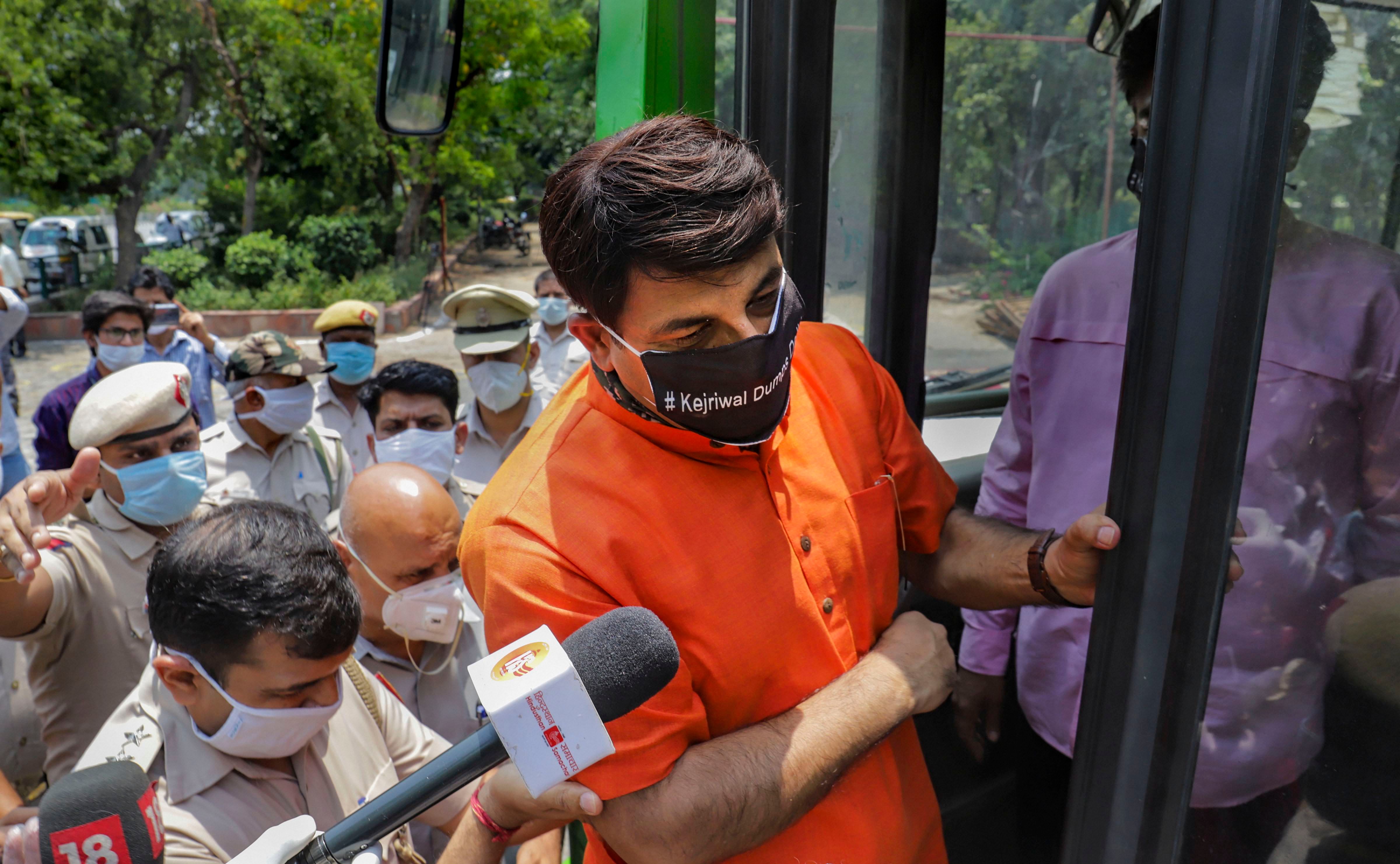 Delhi BJP President Manoj Tiwari being detained after he tried to hold a dharna at Rajghat against the AAP government's alleged failure in handling of novel coronavirus pandemic, in New Delhi, Monday, June 1, 2020. (PTI Photo) 