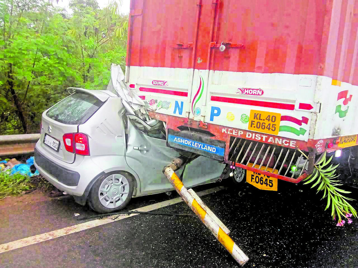 The mangled remains of the car after it rammed a fish truck on NH 66 near Nethravathi bridge on Sunday.