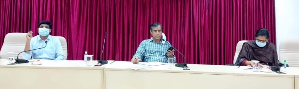 District In-charge Secretary M Maheshwar Rao chairs a meeting at Zilla Panchayat Hall in Manipal. DH photo 