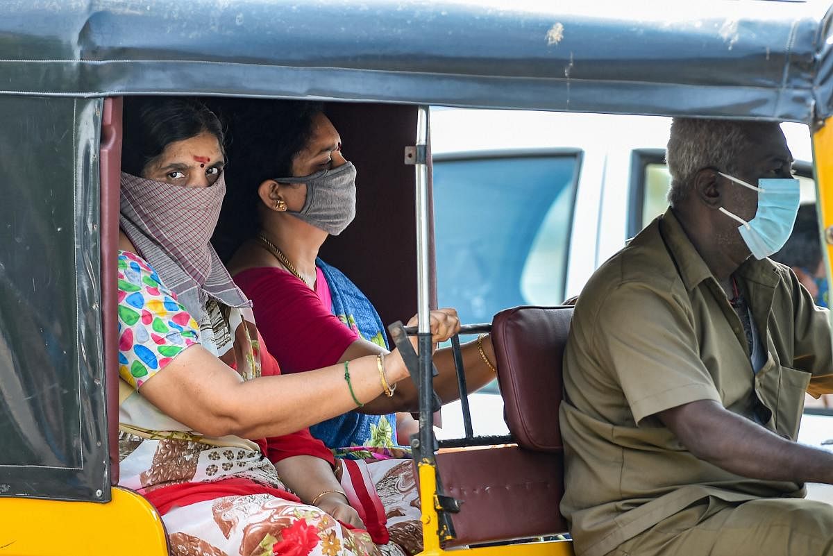 Chennai: Passengers wearing face masks sit in an auto-rickshaws operating after a gap of over two months after ease of restrictions in the fifth phase of the COVID-19 lockdown, Monday, June 1, 2020. (PTI Photo/R Senthil Kumar)