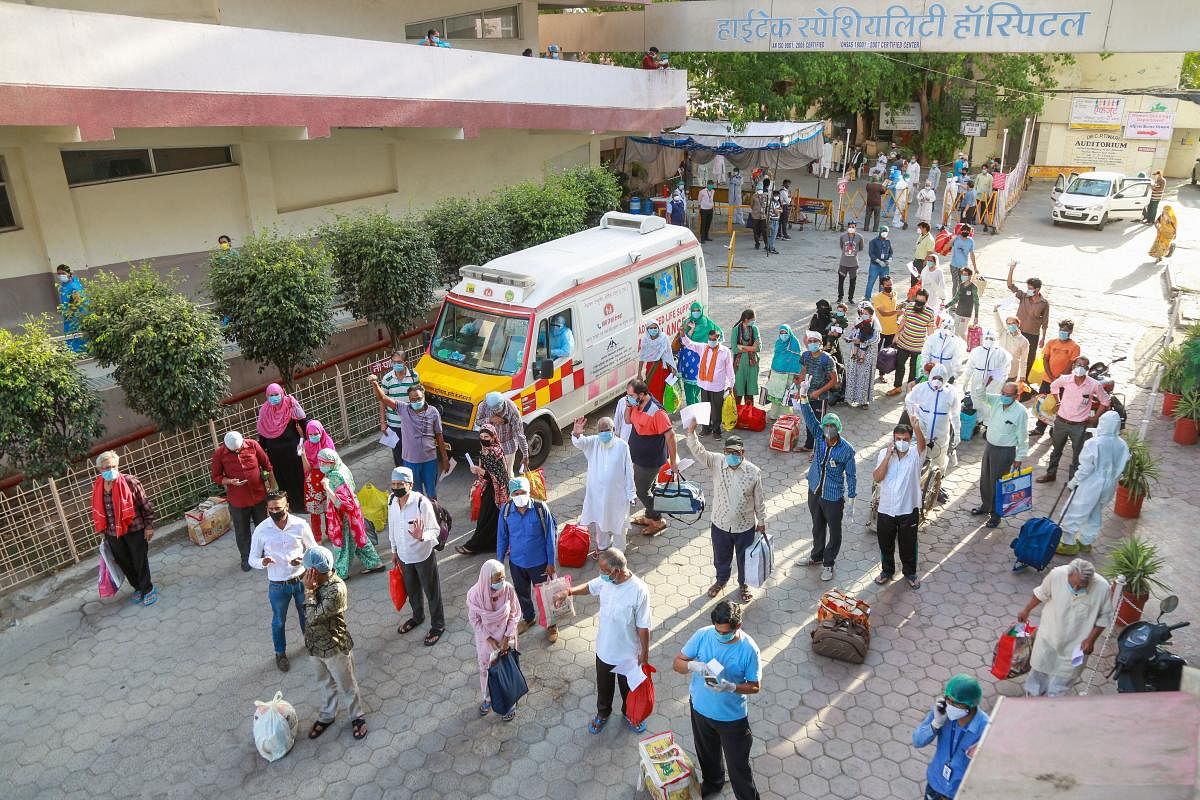 Patients recovered from COVID-19 leave after being discharged from Aurobindo Hospital during the nationwide lockdown, in Indore, Saturday, May 9, 2020. (PTI Photo)