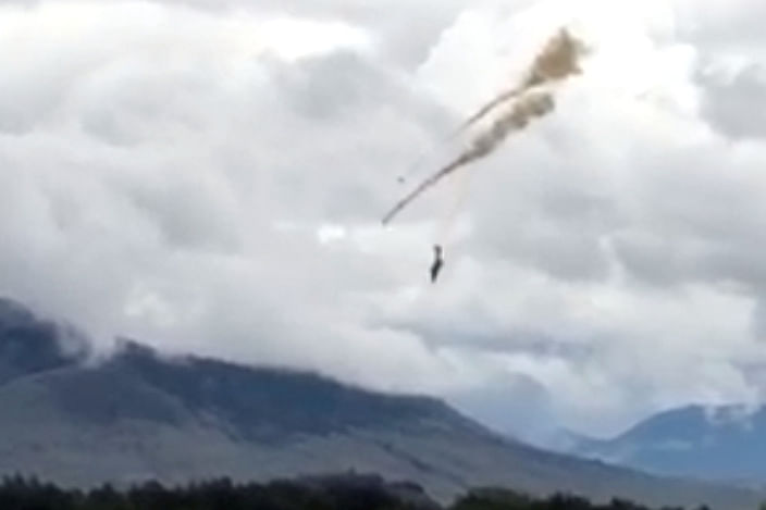 A plane of the Canadian Air Force's Snowbirds aerobatic demonstration team is seen prior crashing in Kamloops, British Columbia, Canada May 17, 2020, in this still image obtained from a social media video. Shannon Forrest/via REUTERS