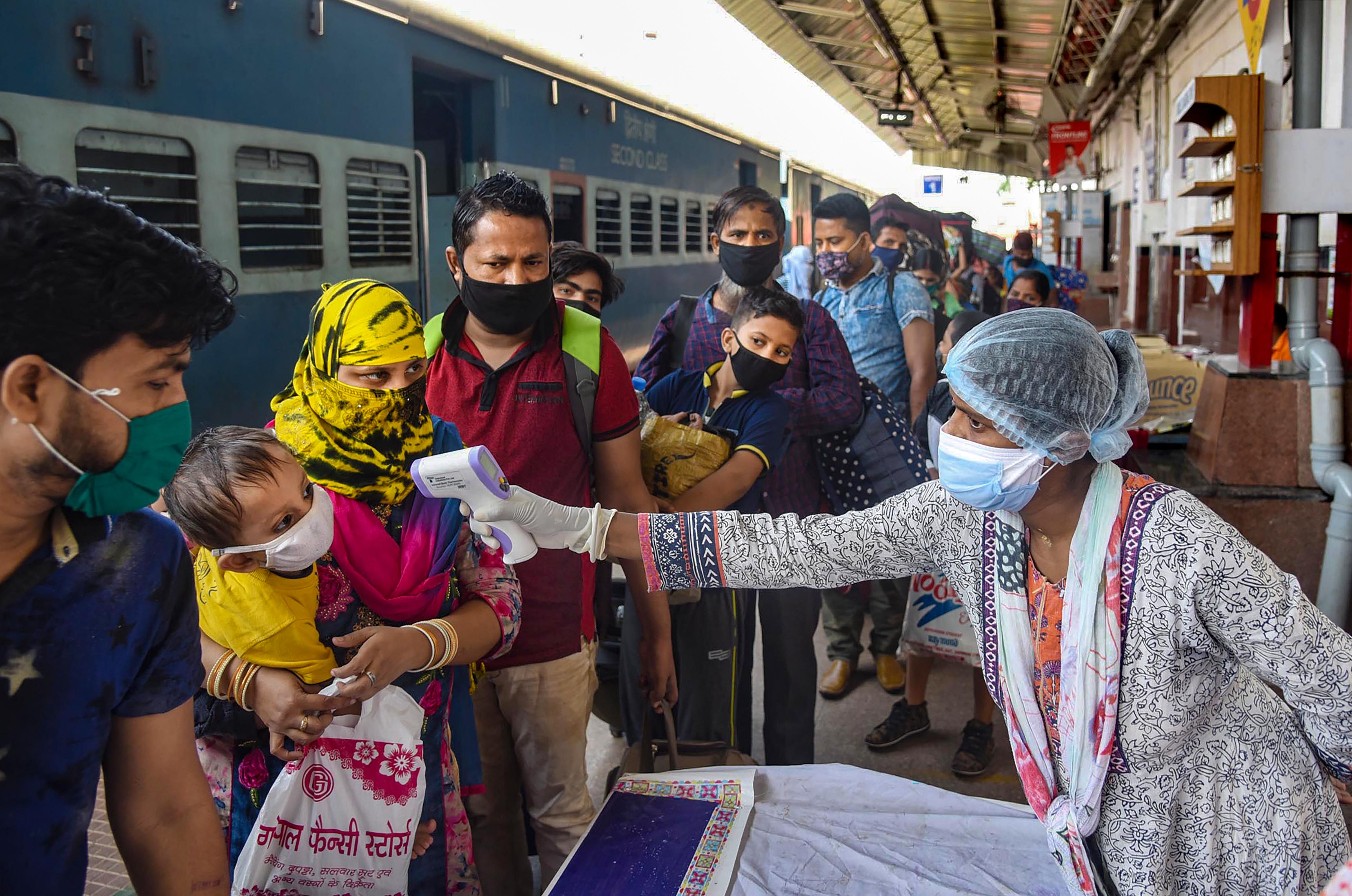 Migrants arriving from Mumbai undergo screening at Danapur Railway Station, Bihar. (PTI photo)