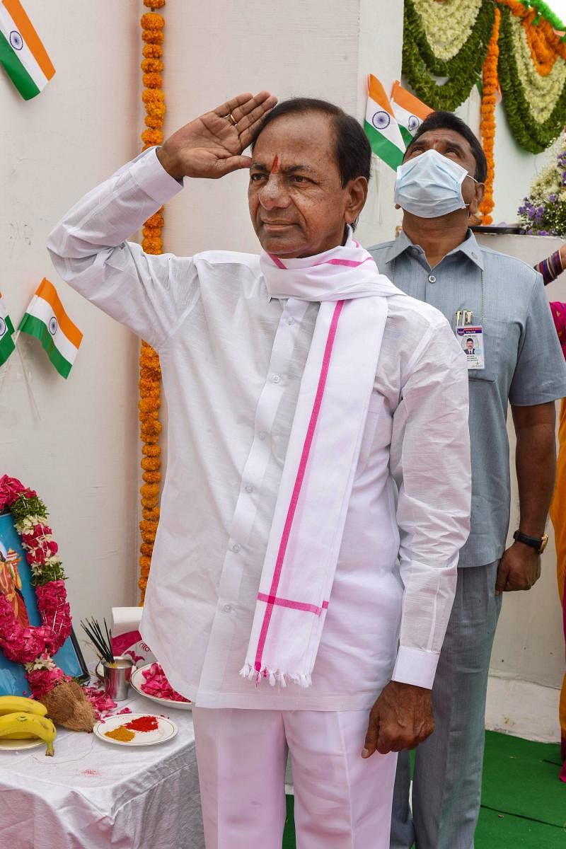 Telangana Chief Minister and TRS chief K. Chandrashekhar Rao salutes to the national flag after hoisting it on 'Telangana Foundation Day', at Pragati Bhavan in Hyderabad, Tuesday, June 2, 2020. (PTI Photo)