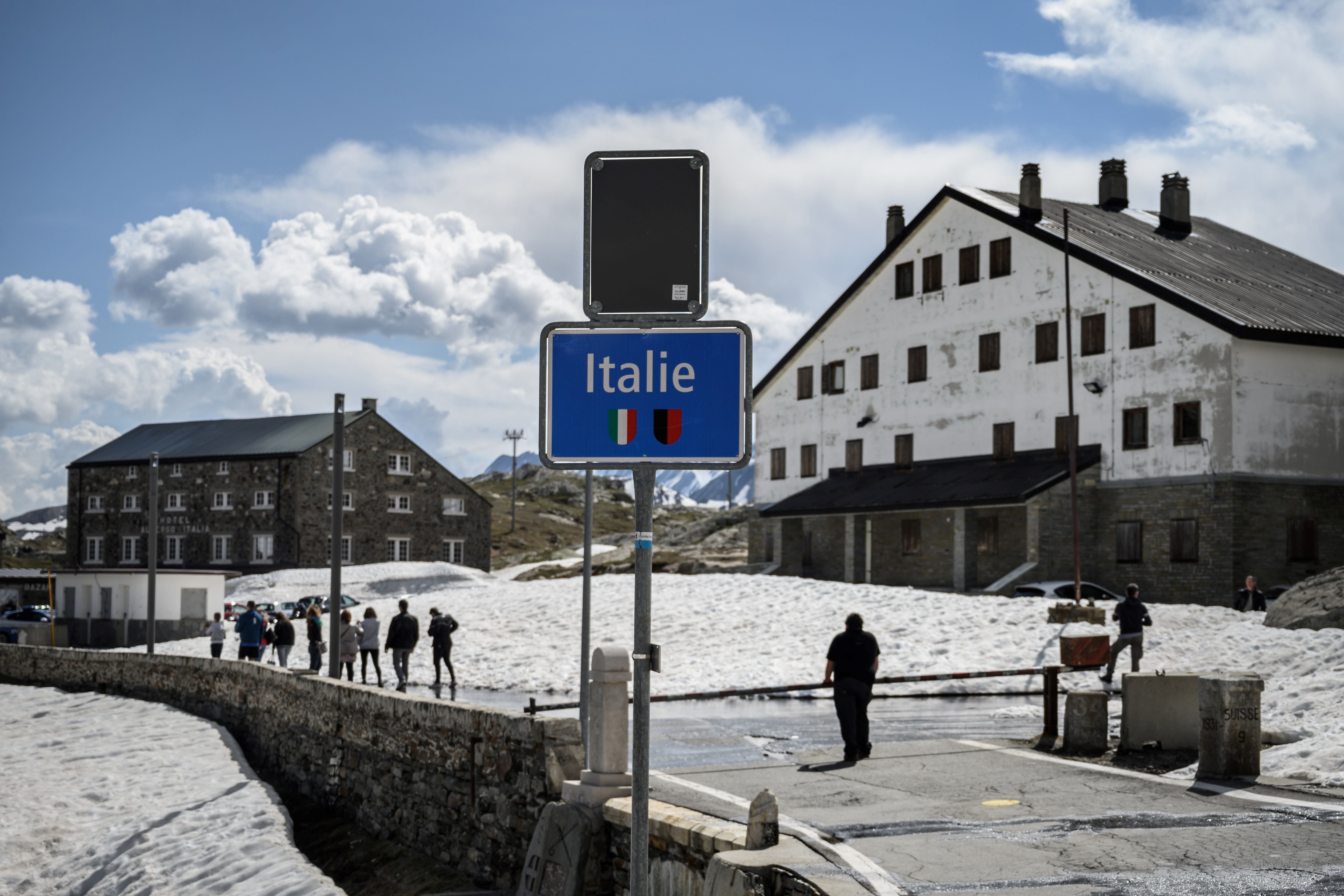 A man stands at the Swiss-Italian closed border at Grand Saint Bernard pass. (AFP Photo)