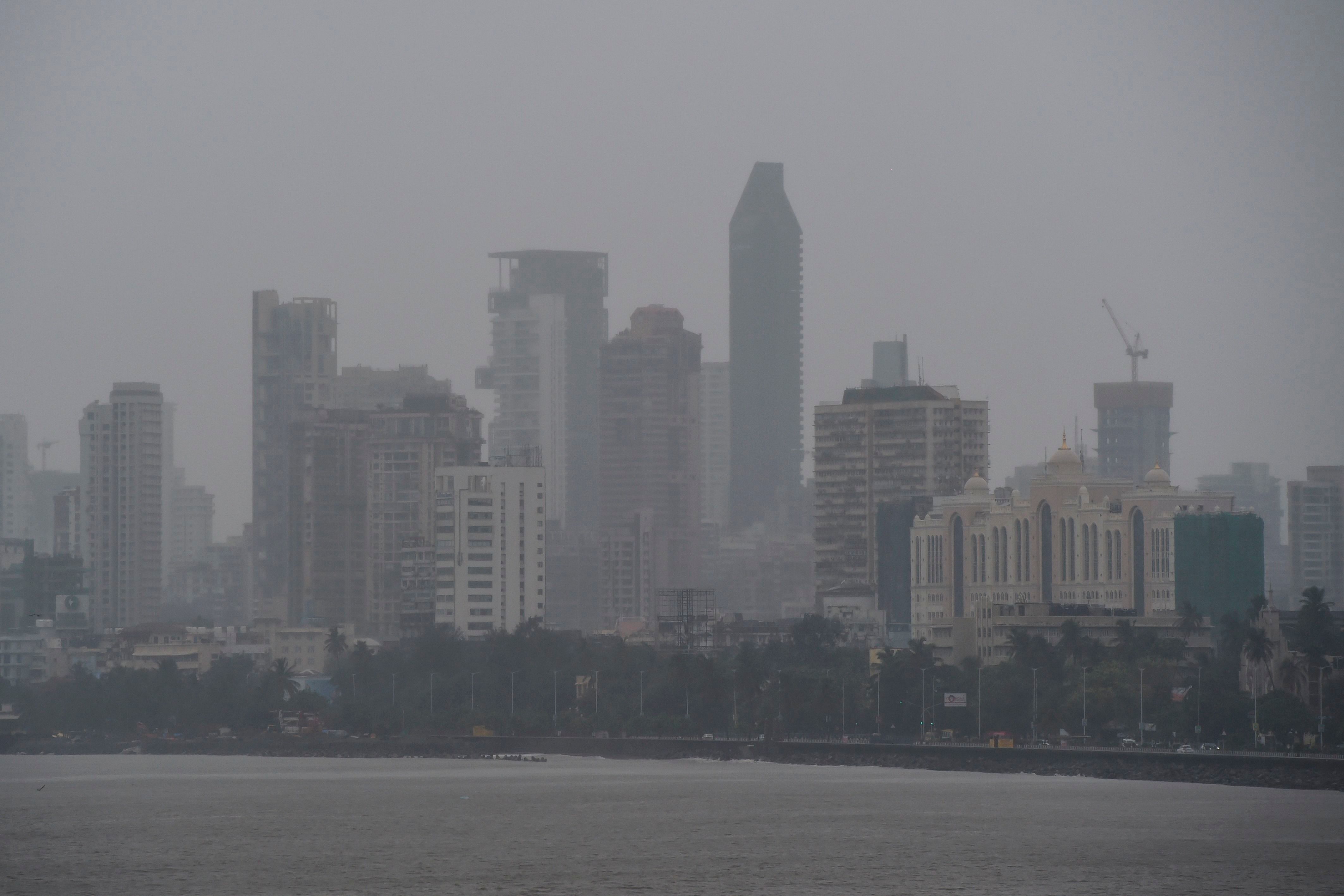 Mumbai authorities shut offices, banned small gatherings and told people to stay home on June 3 as the Indian megacity's first cyclone in more than 70 years approached. Cyclone Nisarga was expected to make landfall near the coastal town of Alibag, around 100 kilometres (60 miles) south of Mumbai, on June 3 afternoon, forecasters said. (Photo by AFP)