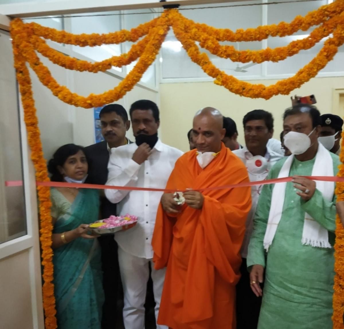 Adichunchanagiri seer Nirmalanandanatha Swami inaugurates the new Covid-19 testing lab at Adichunchanagiri Institute of Medical Sciences, Nagamangala taluk, Mandya district, on Wednesday.