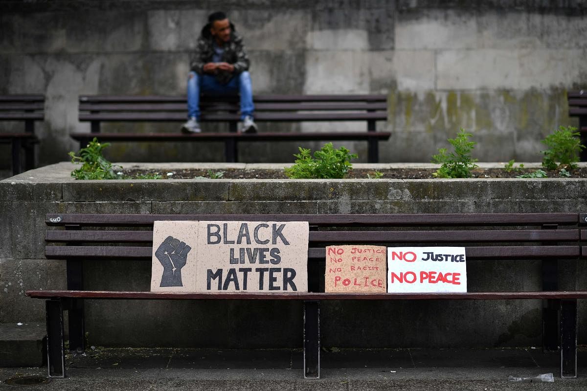 Placards are left on a bench during an anti-racism demonstration (AFP Photo)
