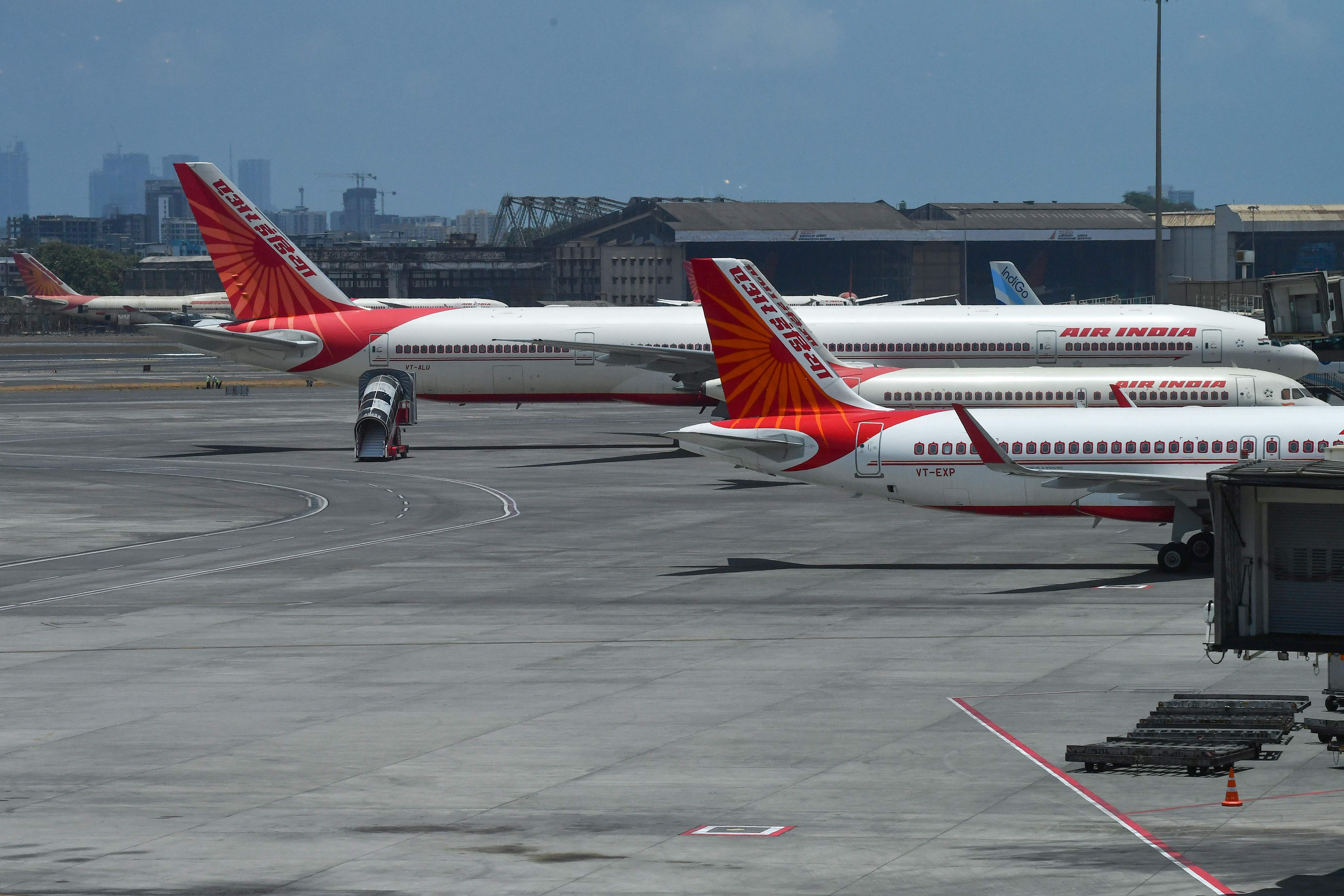 Air India aircrafts are seen parked at the Chhatrapati Shivaji Maharaj International Airport (CSMIA) after domestic flights resumed, in Mumbai. (AFP Photo)