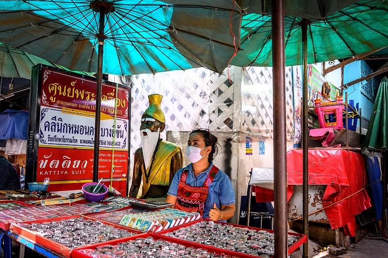  vendor wearing a face mask waits for customers at a Buddhist amulet market in Bangkok on June 2, 2020, as more sectors of the economy are reopen following restrictions to halt the spread of the COVID-19 novel coronavirus. (AFP Photo)