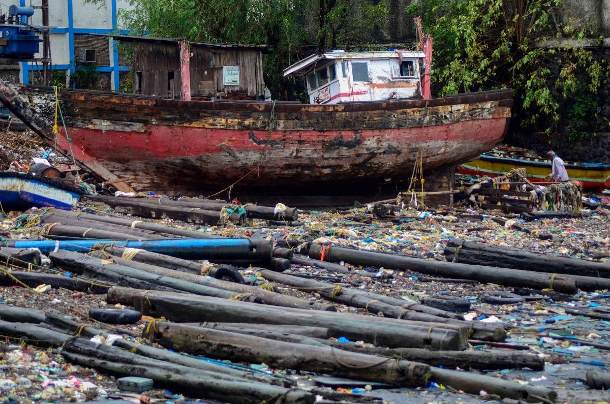 A damaged boat washed ashore at Mora Jetty, in the aftermath of Cyclone Nisarga, in Navi Mumbai. (PTI Photo)