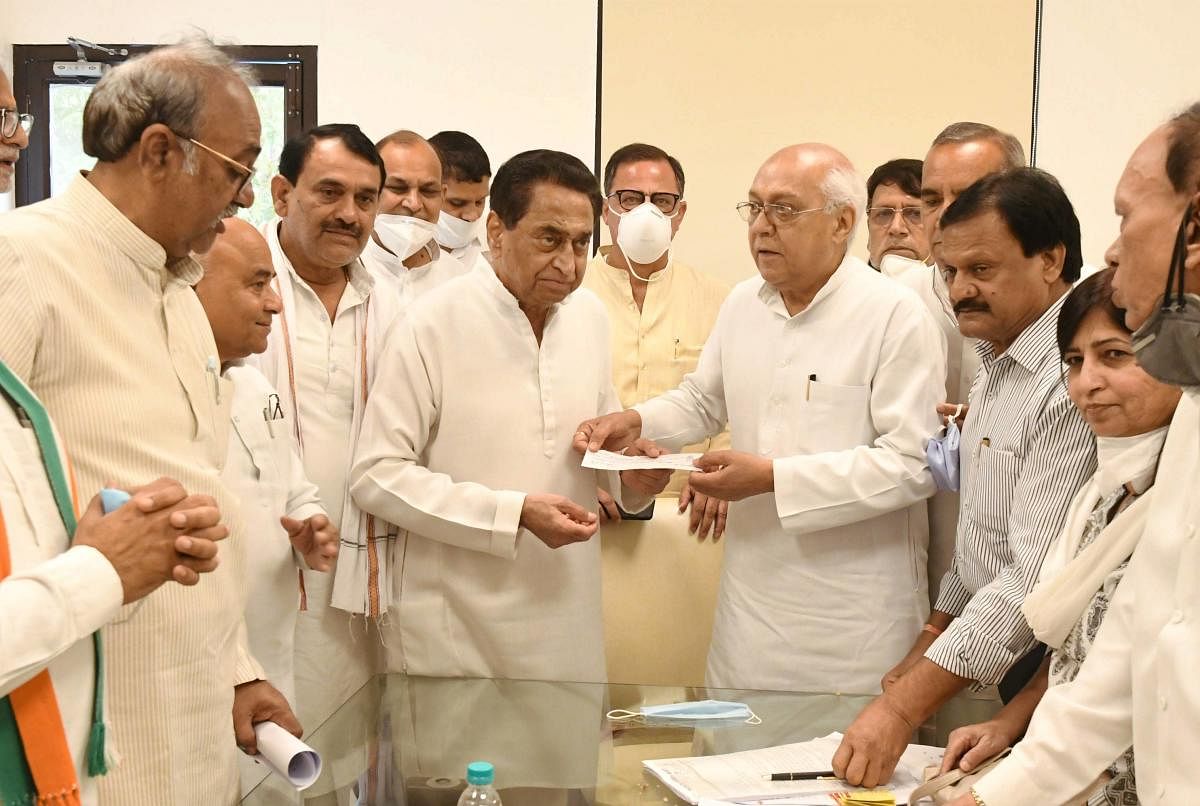 Senior BJP leader and former Cabinet Minister Balendu Shukla joins Congress party along with his supporters in the presence of Madhya Pradesh Congress President Kamal Nath, in Bhopal. PTI