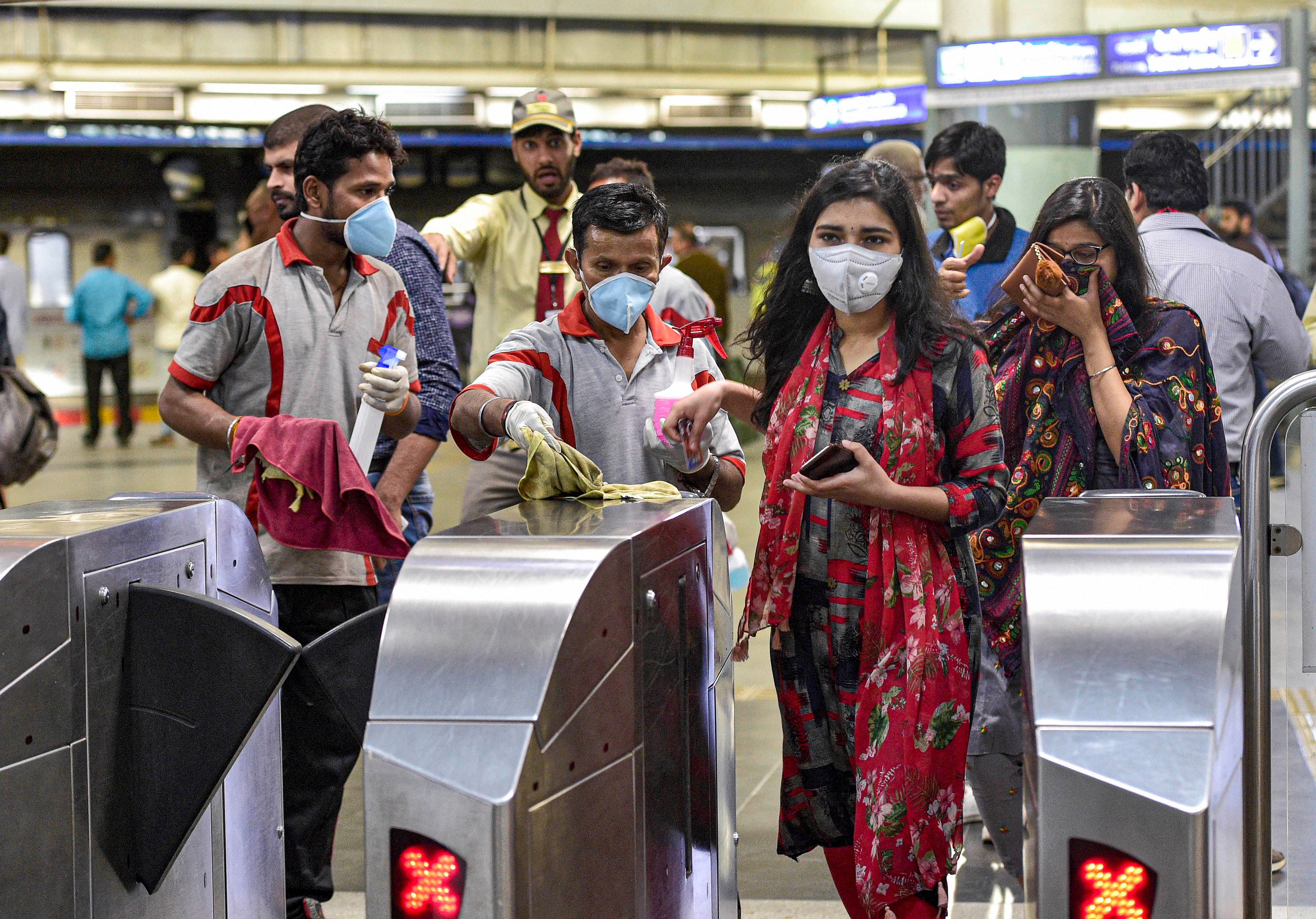 The tweet carried a poster showing the Metro girl, DMRC's mascot, wearing a mask and a pair of gloves. (Credit: PTI Photo)