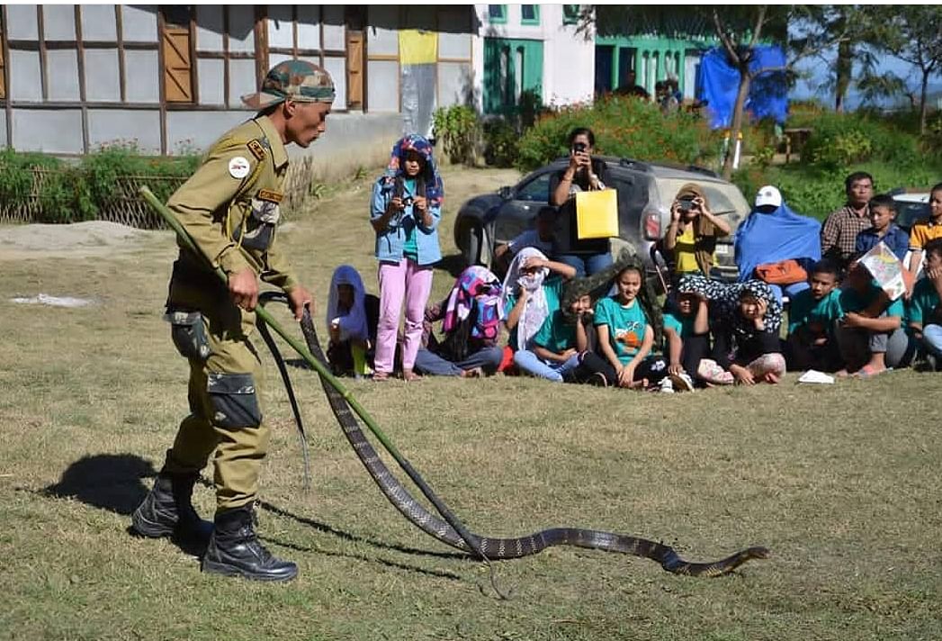 Trained by Gerry Martin, Arunachal youth displaying how to rescue snakes.  (Photo credit: Eaglenest Wildlife Sanctuary, Arunachal Pradesh)