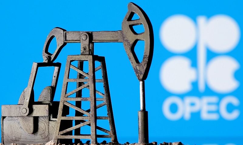 A 3D printed oil pump jack is seen in front of displayed Opec logo. (Reuters Photo)