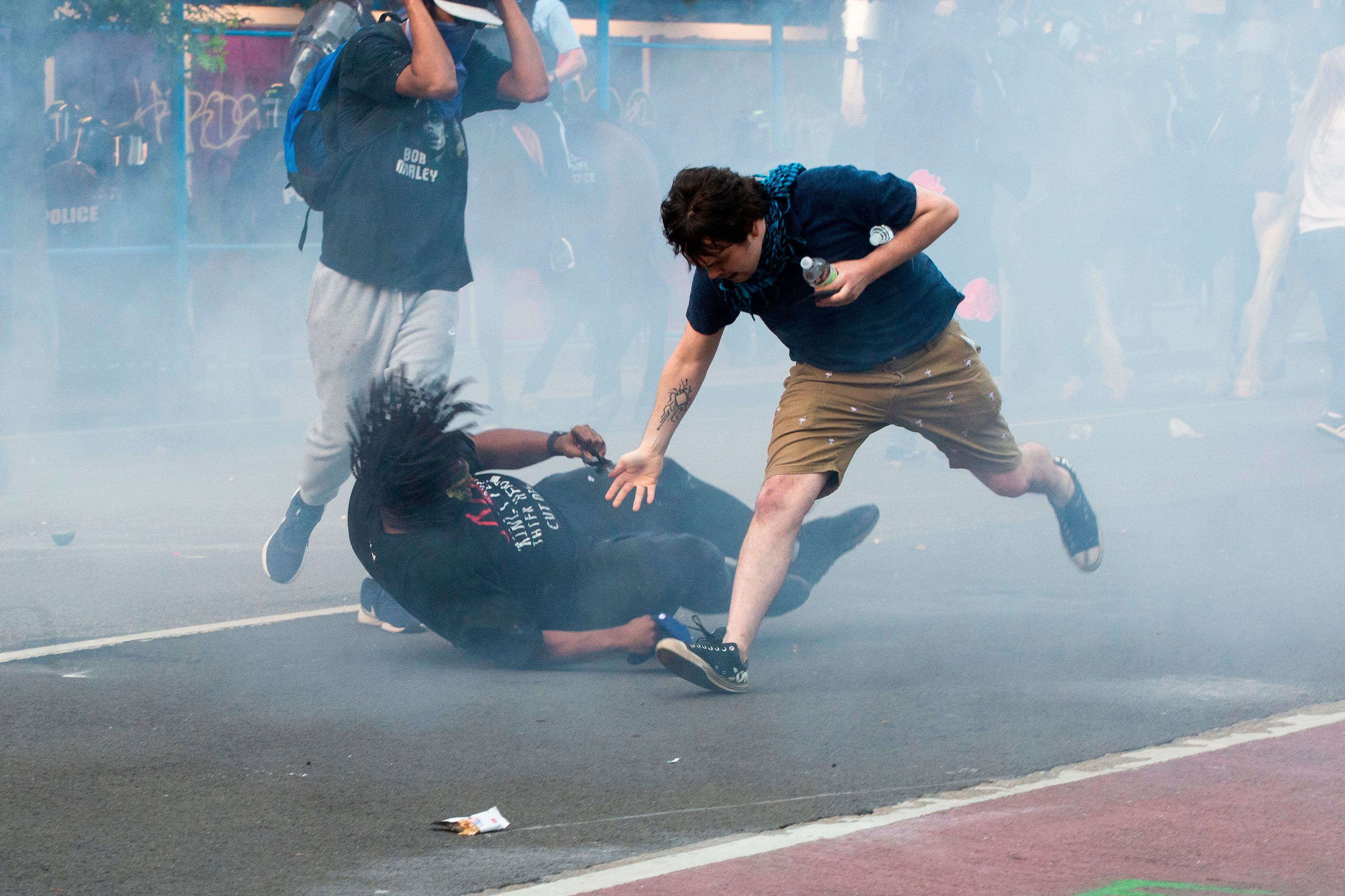 Protestors are tear gassed as the police disperse them near the White House. Credit: AFP Photo