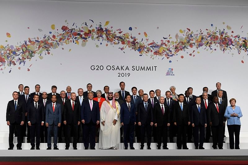 U.S. President Donald Trump and the other leaders pose for a group photo at the G20 summit in Osaka. (AP Photo)