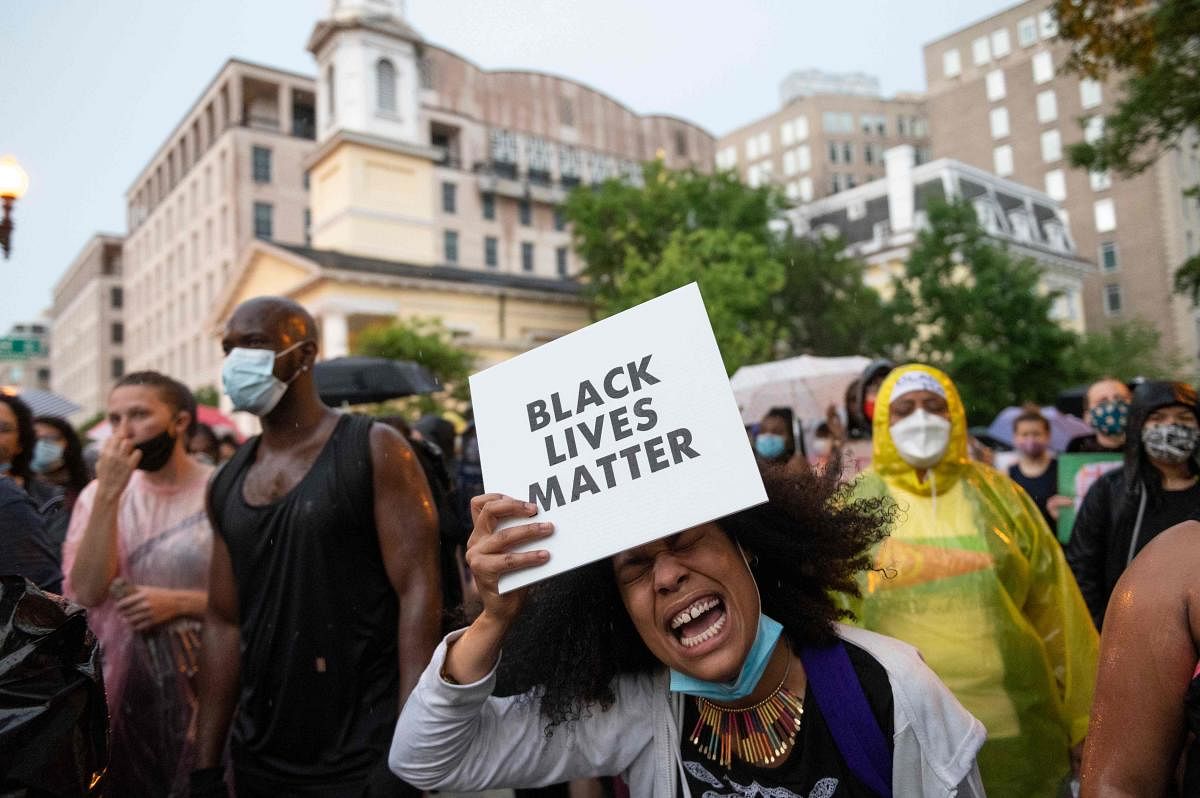 Protesters shout "Black Lives Matter" in front of Lafayette Park next to the White House, Washington, DC on June 5, 2020. Credit/AFP Photo
