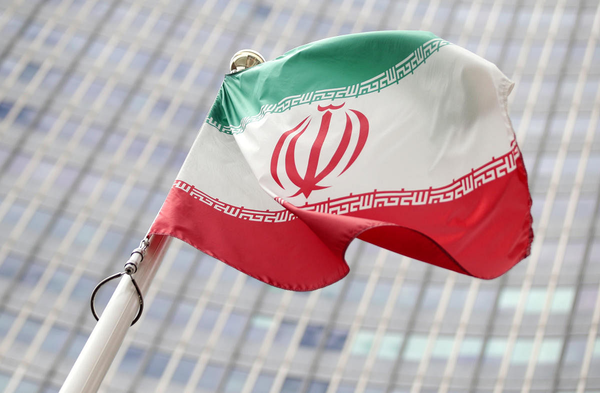 The Iranian flag flutters in front the International Atomic Energy Agency headquarters in Vienna (Reuters Photo)