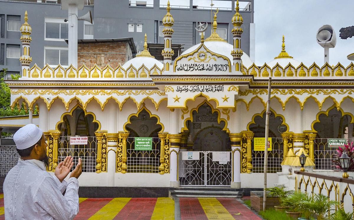 A Muslim man offers Eid-ul-Fitr prayers at a mosque all alone amid ongoing COVID-19 lockdown, in Guwahati, Monday, May 25, 2020. Credit/PTI Photo