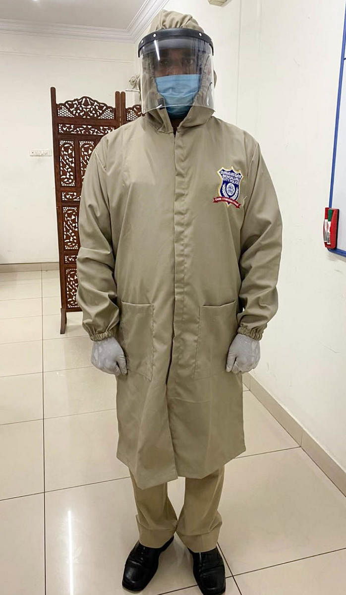 The compartment designed to help maintain distance between the police officers and public. (R) The khaki overcoat for the policemen. Credit: Special Arrangement