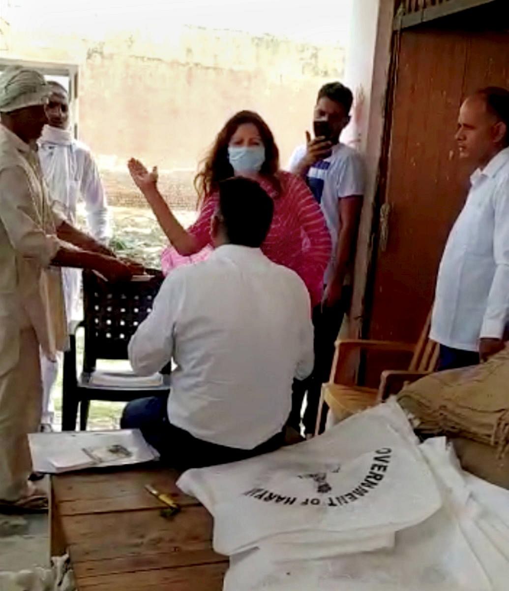 BJP leader Sonali Phogat slaps a market committee officer, alleging that he was using cuss words with a farmer during his visit to a grain market to hear their grievances, at Balsamand in Hisar. PTI