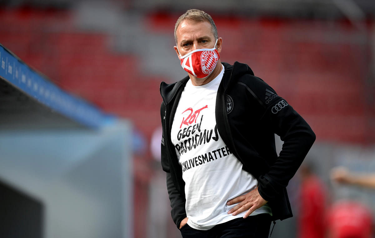 Bayern Munich coach Hansi Flick wearing a shirt with a message reading 'Red against racism #blacklivesmatter' after the match, as play resumes behind closed doors following the outbreak of the coronavirus disease. Reuters