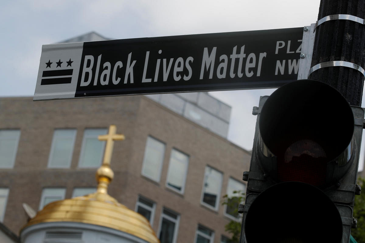 A sign reading "Black lives Matter" is seen on a light pole near White House (Reuters Photo)
