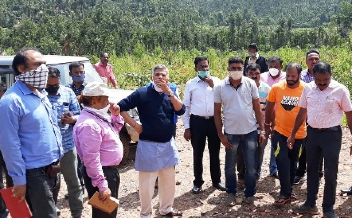 Karnataka State Biodiversity Board President Anantha Hegde Ashisar visits landslide affected Malemane in Mudigere.