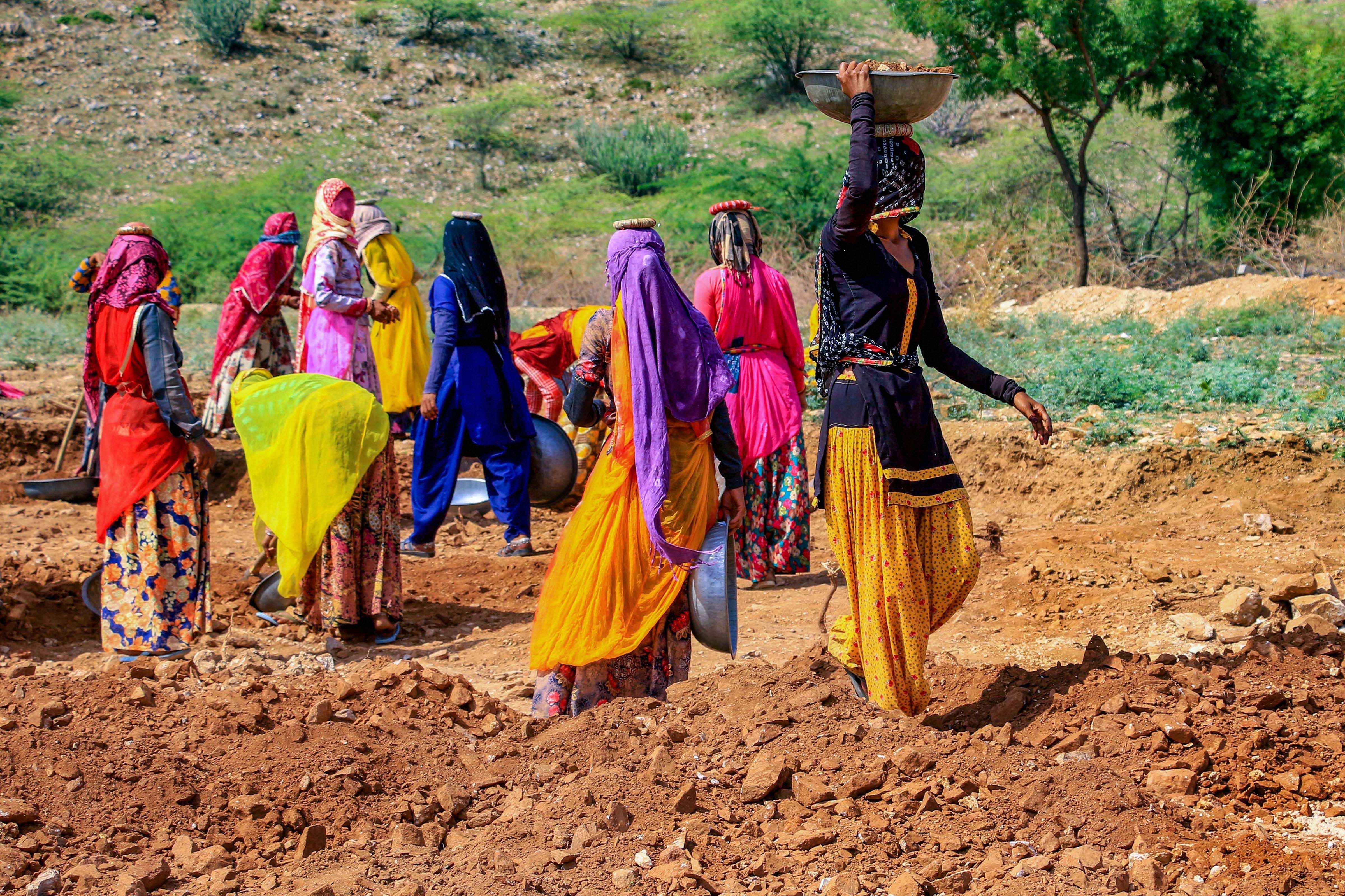 Women labourers work at a site under the Mahatma Gandhi National Rural Employment Guarantee Act (MGNREGA) on the outskirts of Ajmer,. (PTI Photo)