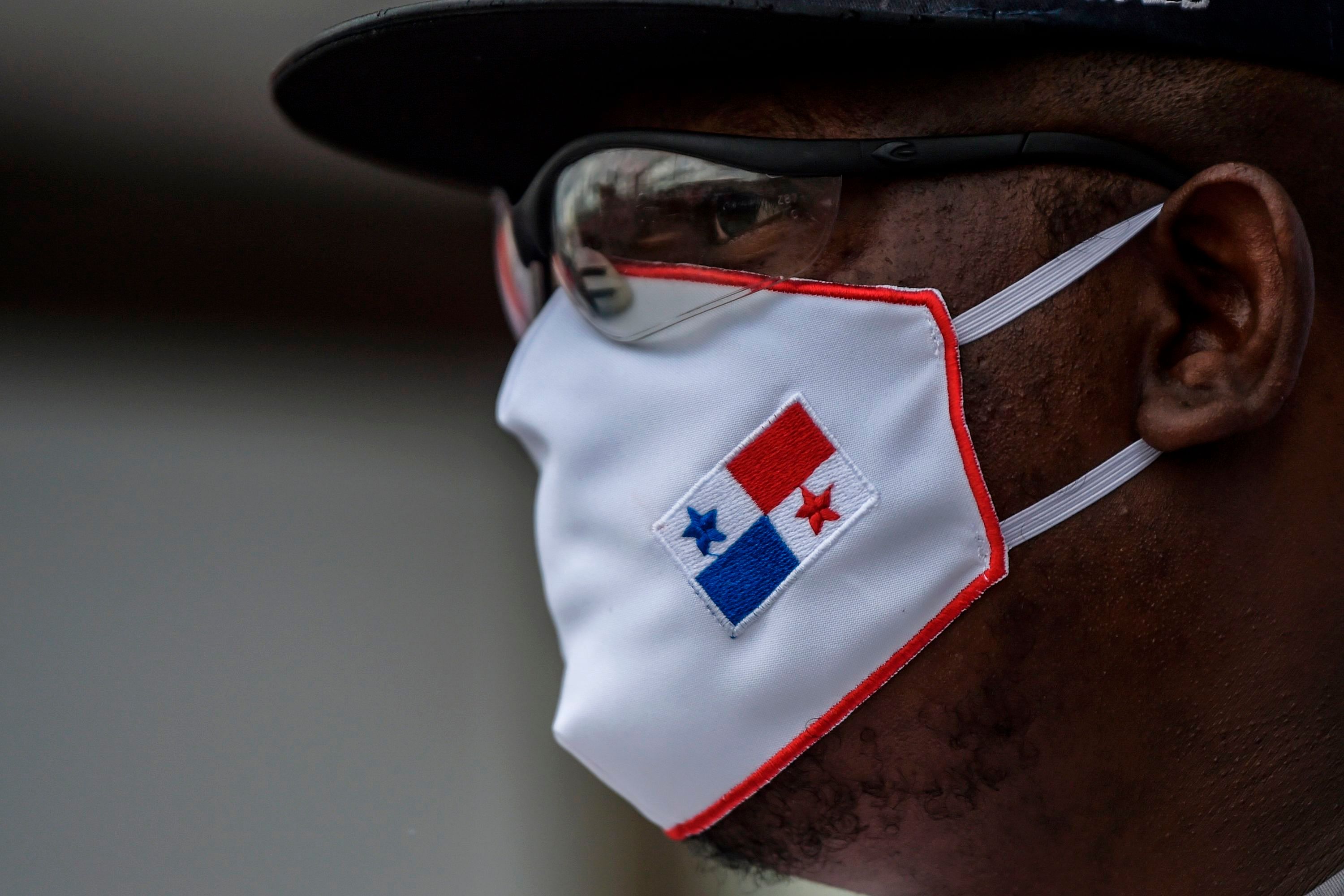 A member of Panama unions wearing a face mask protests against the reopening measures adopted by the Panamanian government after the quarantine that was decreed to prevent the spread of the new coronavirus COVID-19 pandemic. Credit: AFP Photo