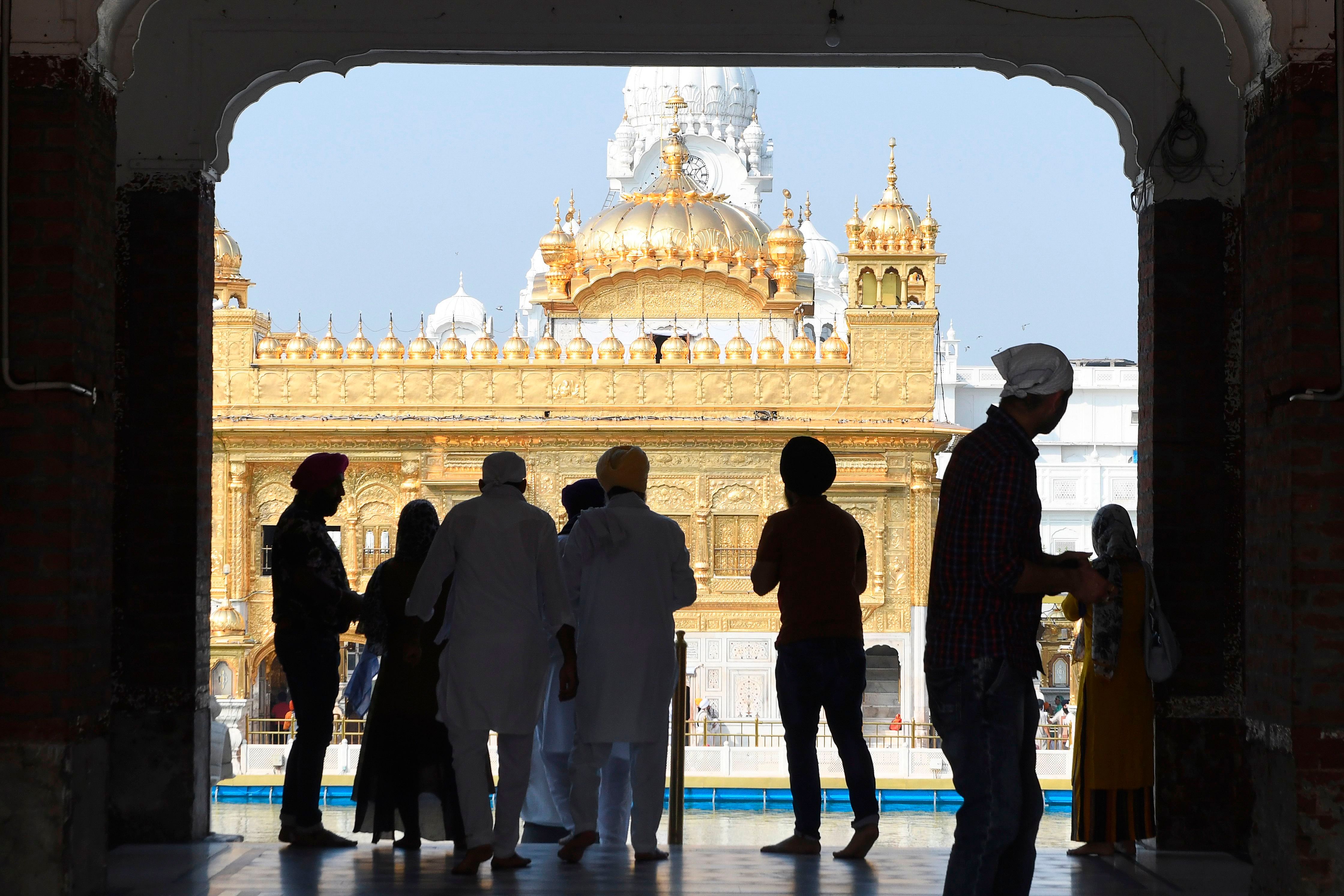 Sikh devotees arrive to pay their respect at the Golden Temple after the government eased a lockdown imposed as a preventive measure against the COVID-19 coronavirus, in Amritsar (PTI Photo)